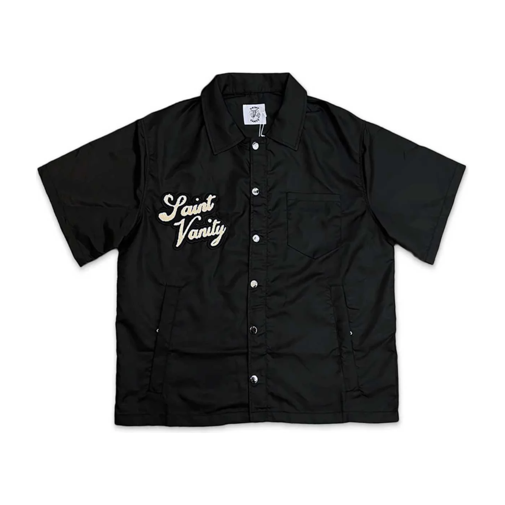 Black Saint Vanity nylon short-sleeve shirt with embroidered logo, white snap buttons, collar, chest & side pockets.