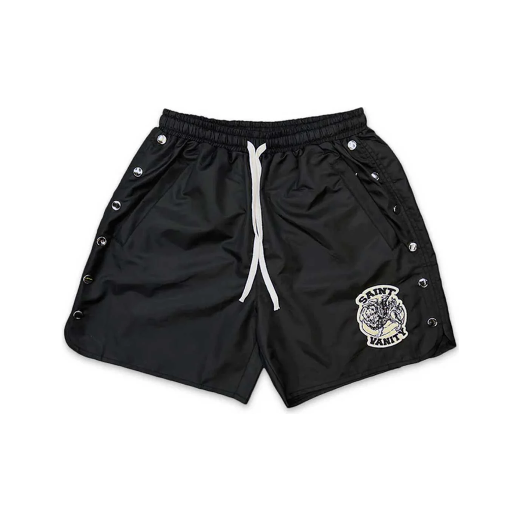 Black nylon shorts with white drawstring, silver snap buttons down both sides, and a Saint Vanity logo patch.