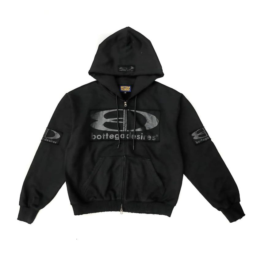 Black Bottega Desires full-zip tech hoodie with large grey BD logo on chest, "D desires" left sleeve, "B bottega" right sleeve.