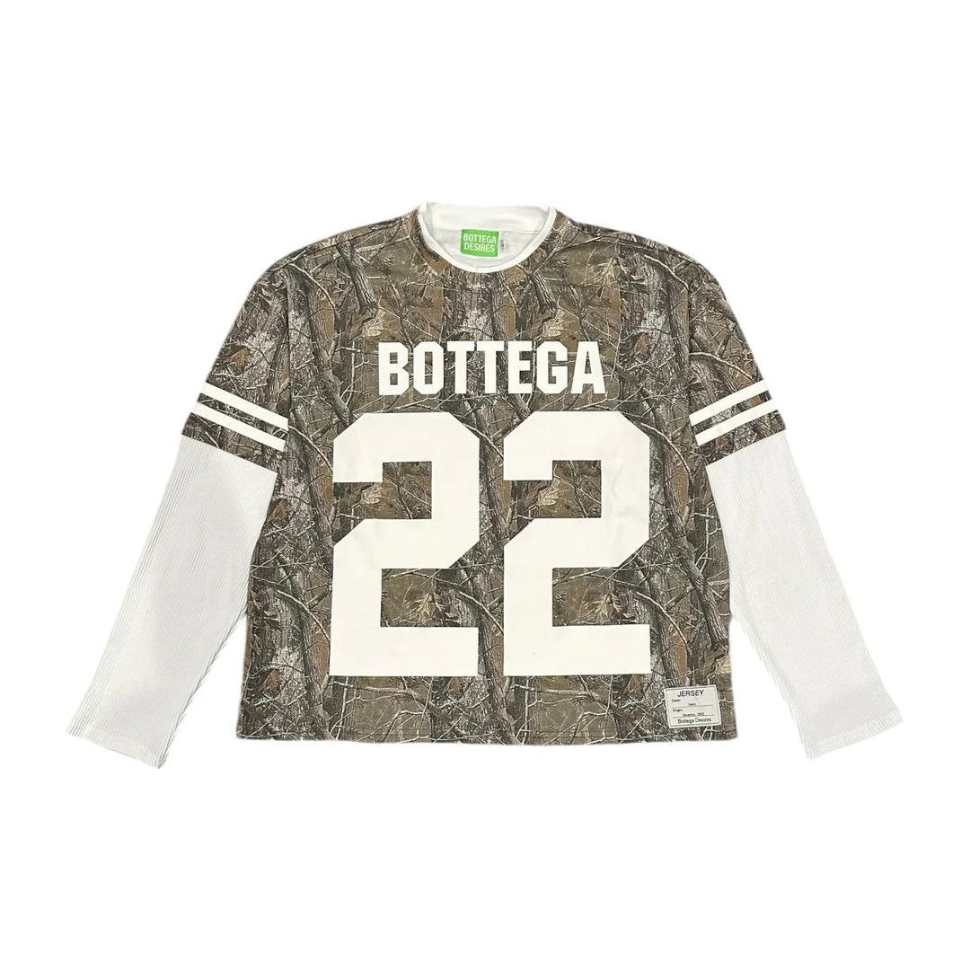 Bottega Desires long sleeve jersey tee: Tree camo body, layered white ribbed sleeves with shoulder stripes, "BOTTEGA" & "22".