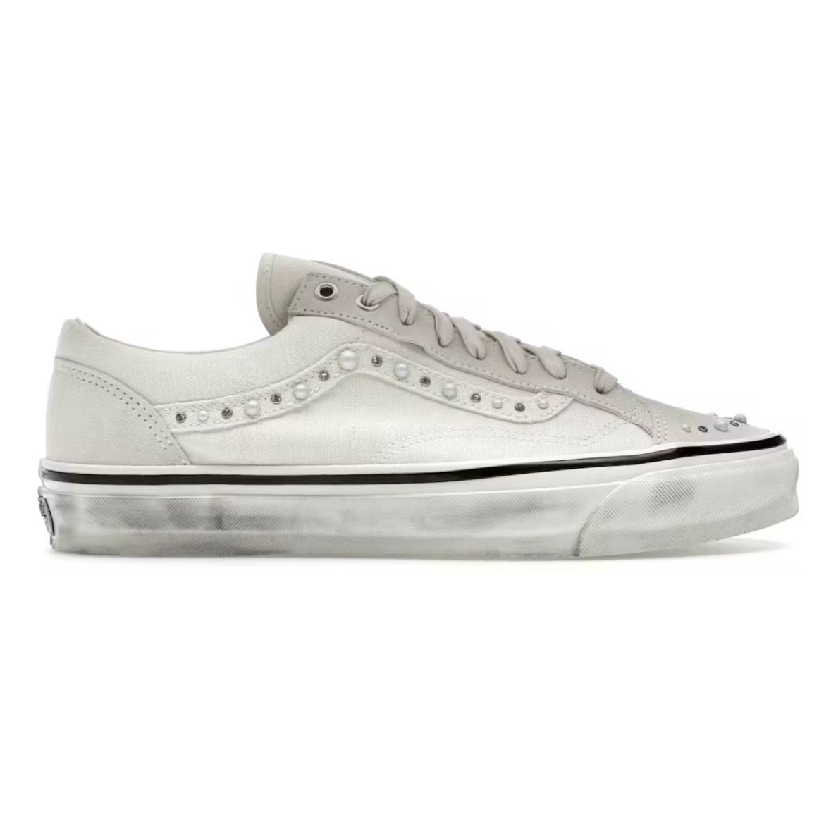 Vans Old Skool 36 Marshmallow sneaker. White canvas & suede upper with pearlized studs along side stripe & toe. Distressed white sole.