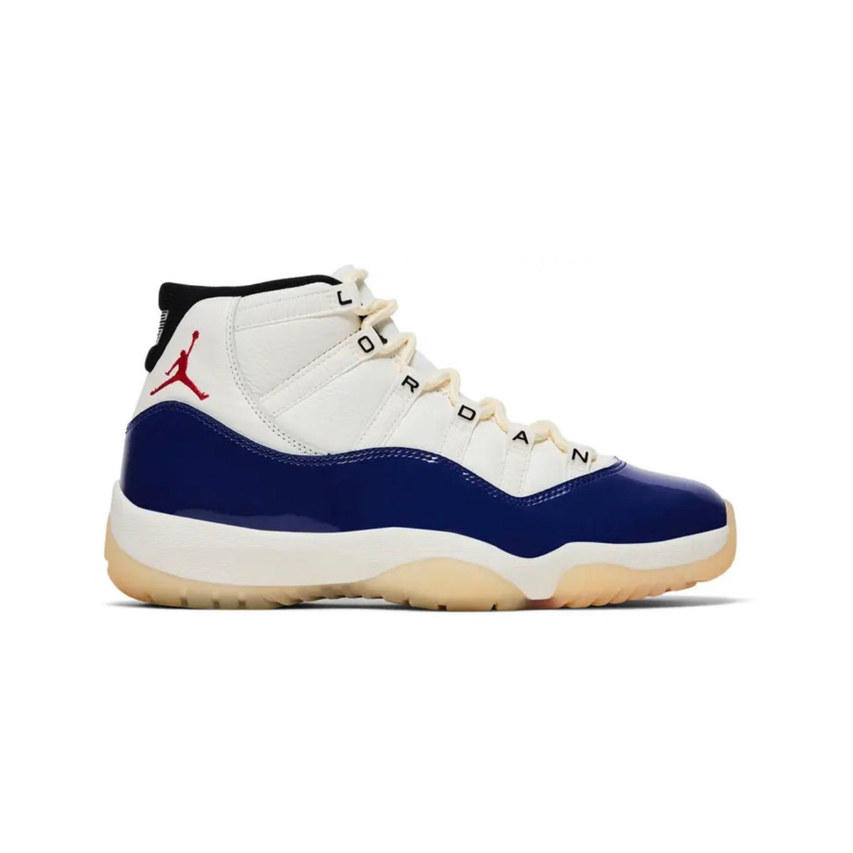 Mid-top Air Jordan 11 Retro sneaker. White upper, glossy royal blue patent leather, red Jumpman, translucent cream sole.