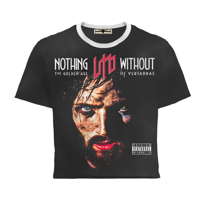 Vertabrae black cropped tee with white collar. Graphic: man's gritty face (blue eye, red lips) & 'NOTHING ☊ WITHOUT' text.