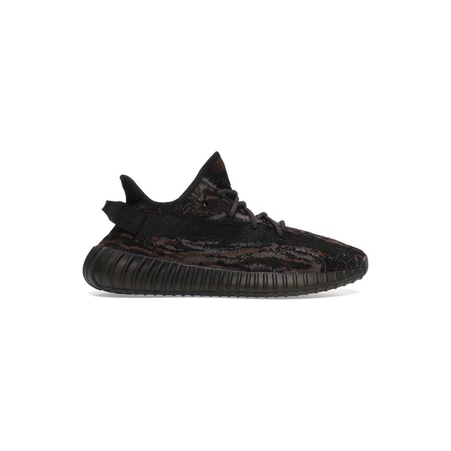 Yeezy 350 V2 MX Rock low-top sneaker. Dark knit upper with swirling black, brown, and dark red pattern. Matching ribbed Boost sole.