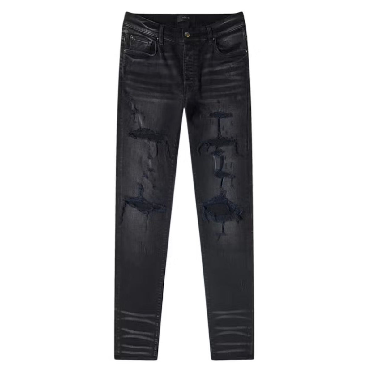 AMIRI Thrasher Plus jeans, aged black, with large rips, heavy distressing, and stacked ankles.