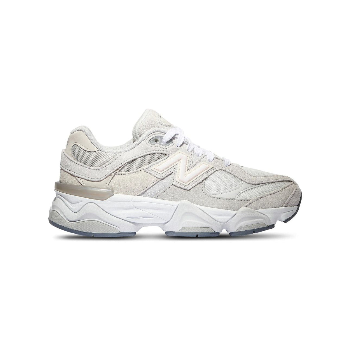 New Balance 9060 Silver Grey sneaker with light grey mesh/suede upper, prominent N logo, and chunky stacked white midsole.