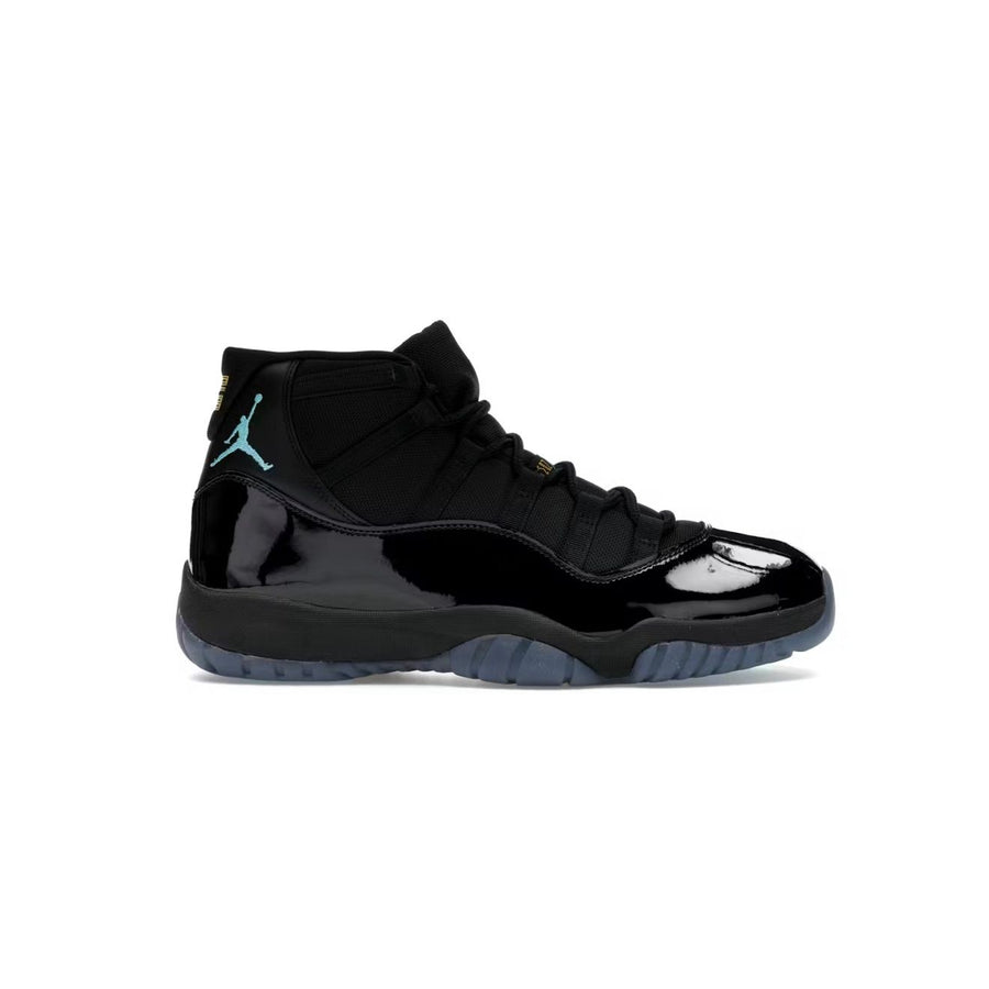Air Jordan 11 Retro Gamma high-top in black. Features shiny black patent leather, matte upper, teal Jumpman, icy blue sole.