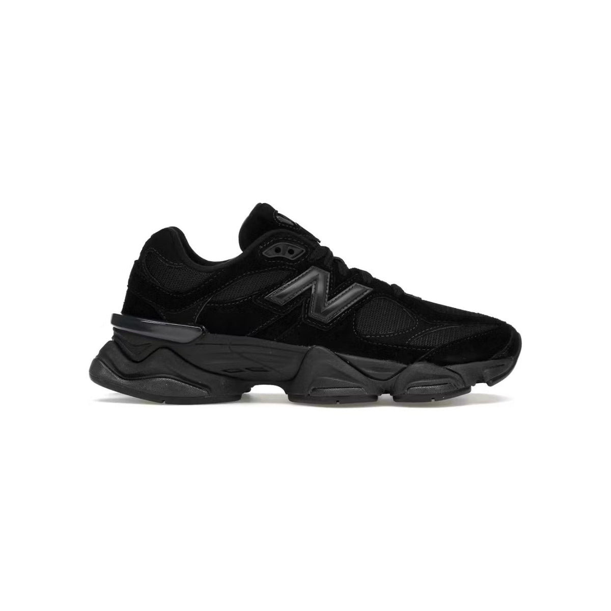New Balance 9060 Triple Black sneaker with a prominent "N" logo, mesh details, and a chunky, sculpted sole.
