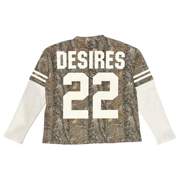 Desires Camo Long Sleeve Tee, back view. Brown/green camo body, white ribbed sleeves with double stripes, white 'DESIRES 22'.