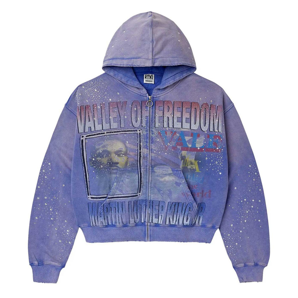 Distressed blue-mauve Vale zip-up hoodie. Features "VALLEY OF FREEDOM," MLK Jr. image, and scattered white sparkling dots.