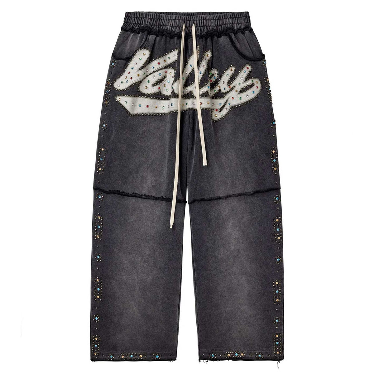 Washed black Vale Forever Skittles sweatpants, white drawstring, 'Vale' logo with colorful rhinestones, and studded legs.
