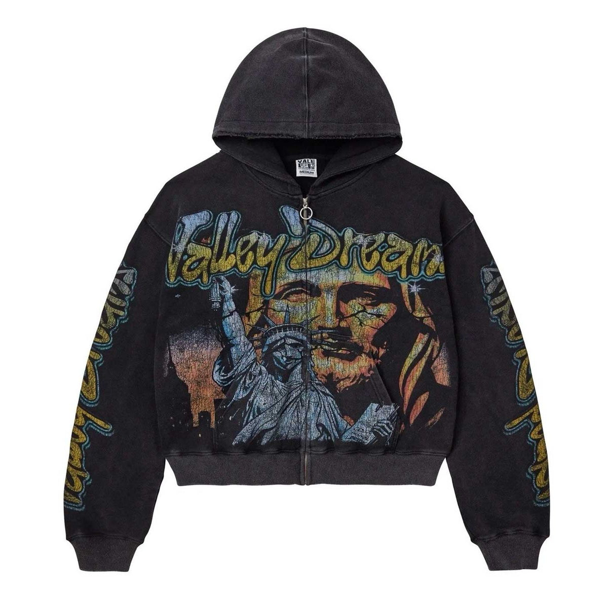 Faded black Vale USA zip hoodie with 'Valley Dream' graffiti text, Statue of Liberty, and Jesus face graphic. Text on sleeves.