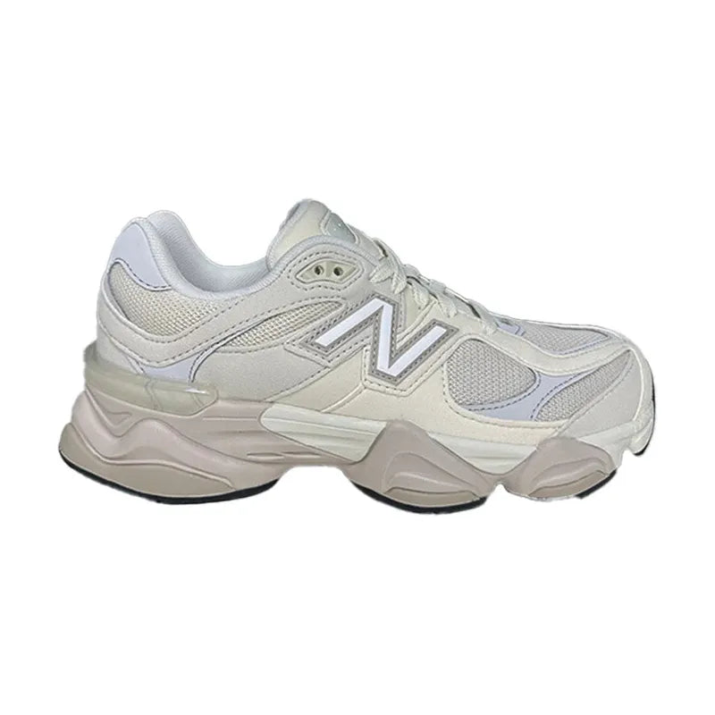 New Balance 9060 beige sneaker with mesh and suede overlays, a chunky sculpted tan sole, and silver-outlined N logo.