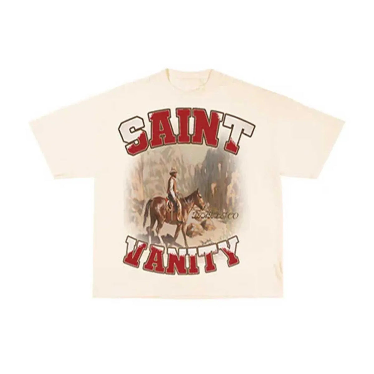 Cream Saint Vanity tee with a western graphic: red "SAINT" top, cowboy on horseback with "FRANCISCO", and red "VANITY" bottom.