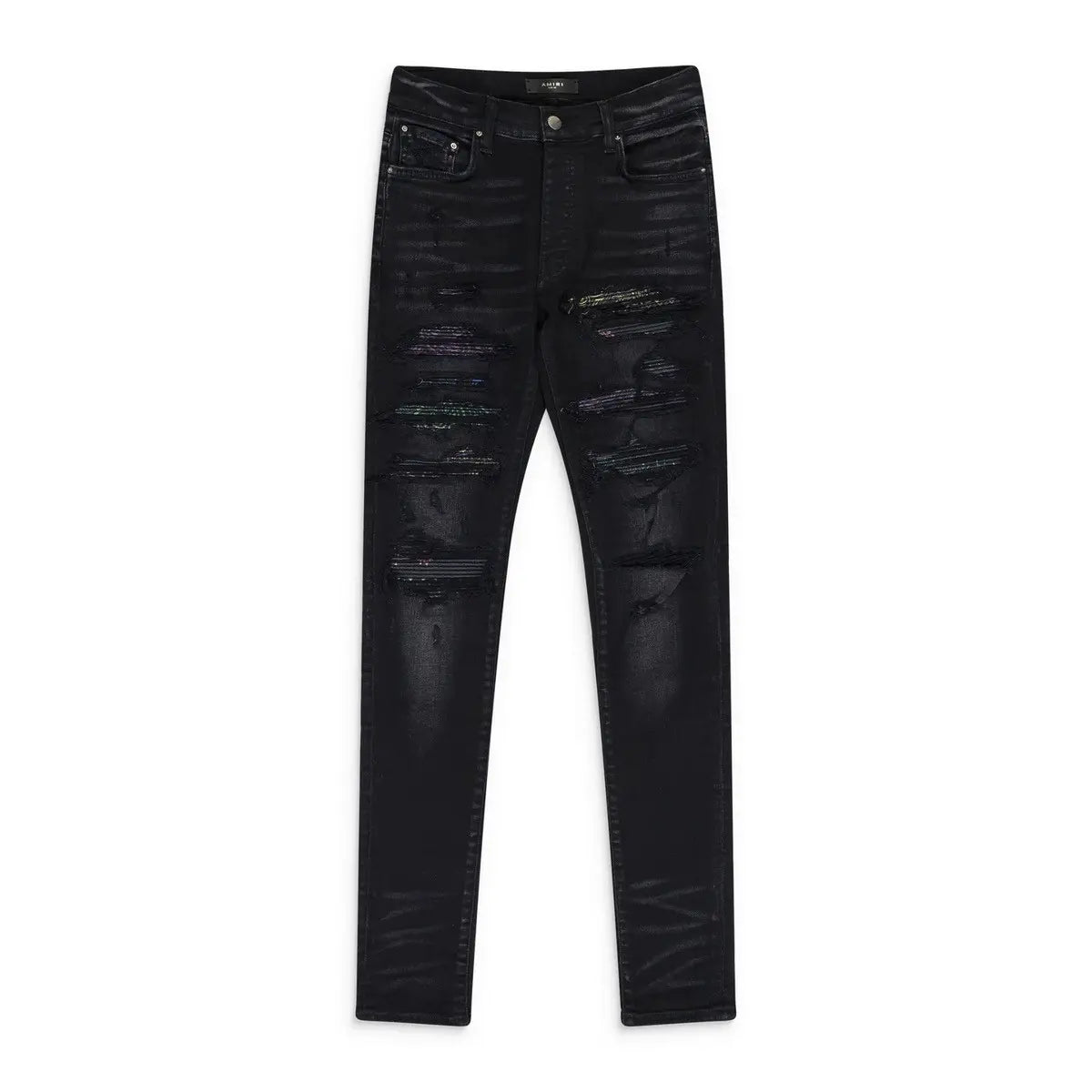 AMIRI black distressed Thrasher jeans with rainbow paisley patches visible through horizontal rips.