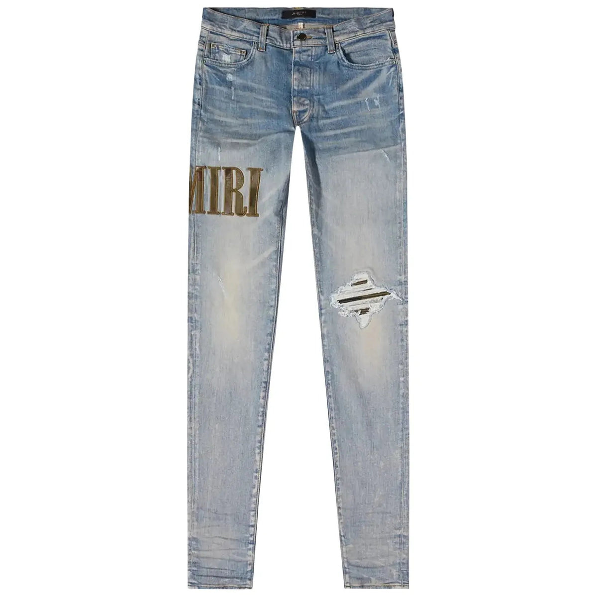 AMIRI Clay Indigo distressed skinny jeans. Light blue denim with gold 'AMIRI' appliqué, ripped right knee & dark patch.