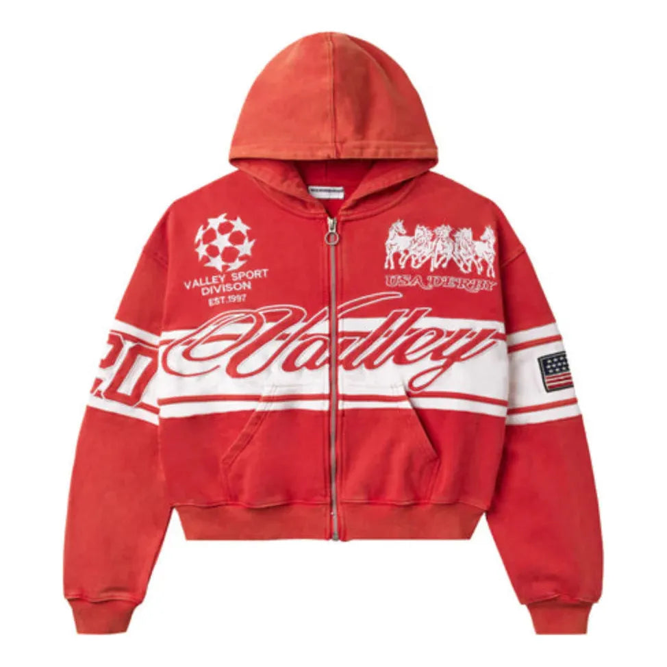 Washed red zip-up hoodie. White "Valley" cursive logo, horizontal stripes, soccer ball, "USA DERBY" horses, and US flag patch.