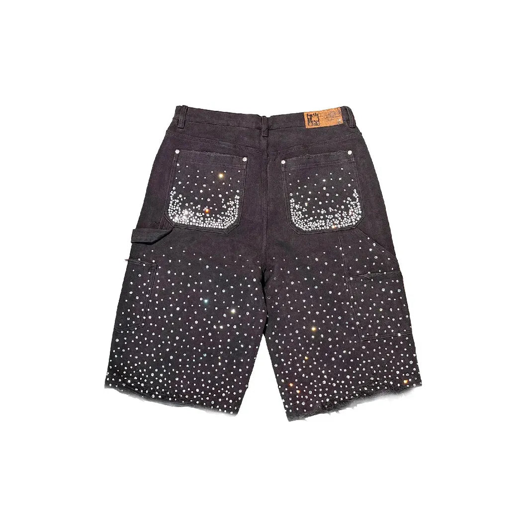 Birth of Royal Child Redial washed black shorts with scattered diamonds, dense on back pockets, and frayed hem.