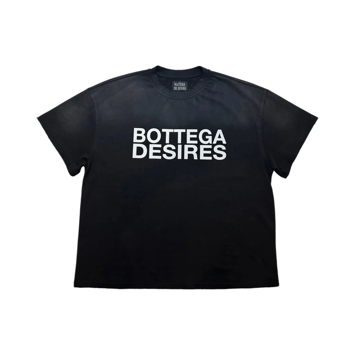 Black short-sleeve tee with "BOTTEGA DESIRES" in bold white text on front. Matiere de Desirs tag visible at neck.