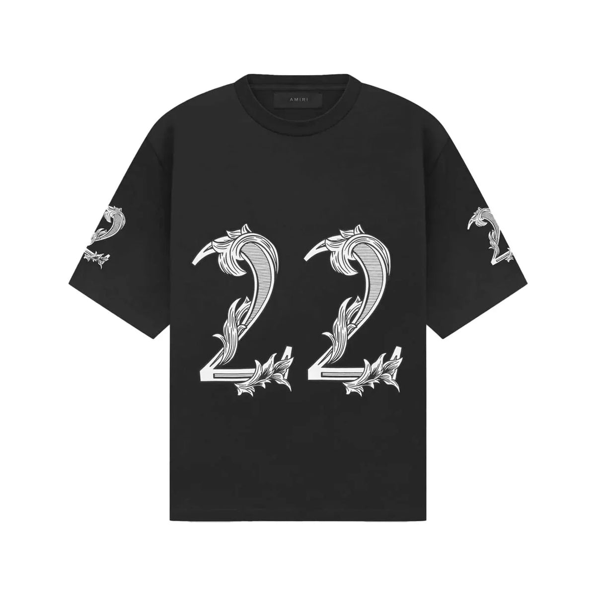 AMIRI oversized black tee featuring a large white '22' graphic with ornate, dollar-bill style scrollwork on front and sleeves.