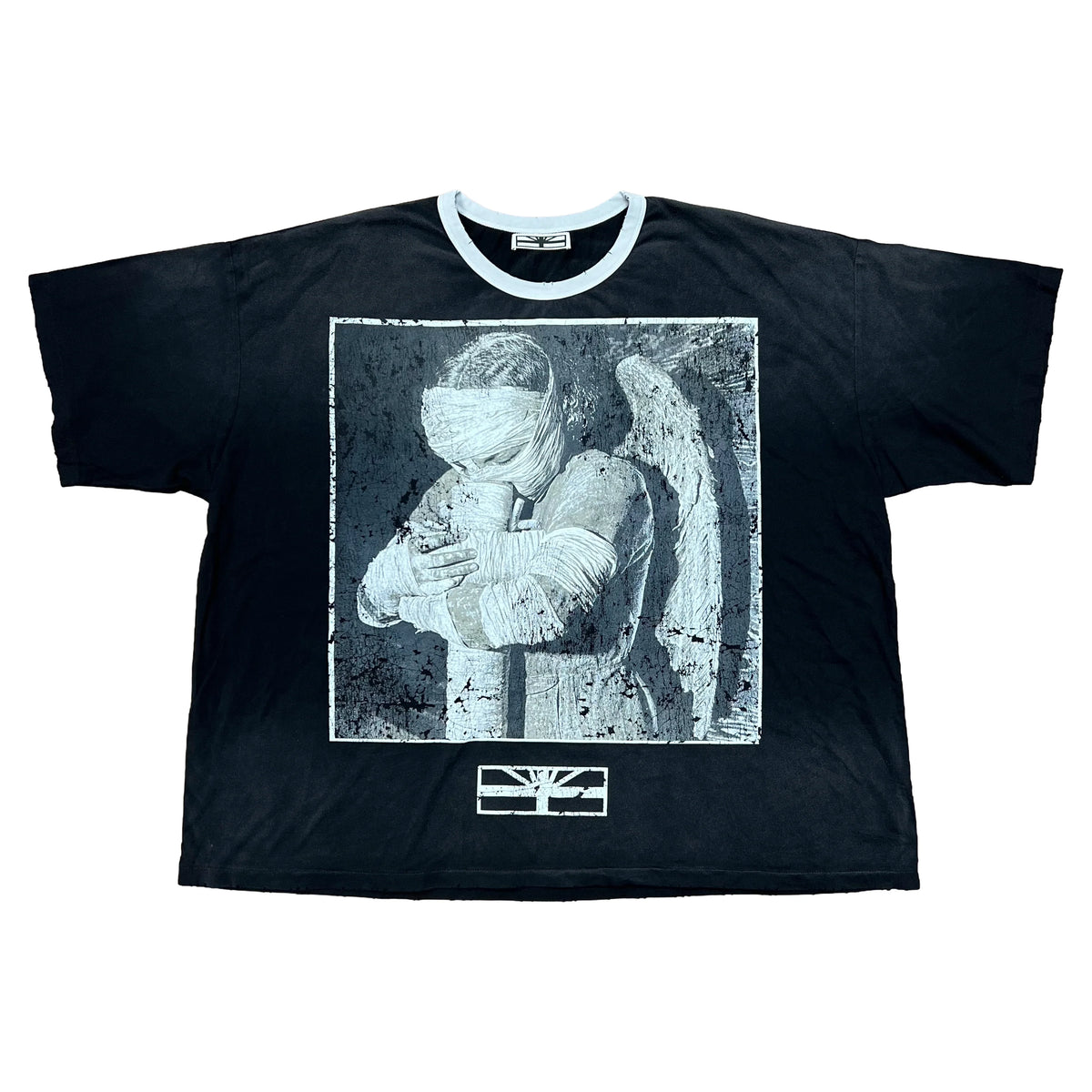 Black Vertabrae ringer tee with white collar. Distressed graphic of a bandaged winged figure; Vertabrae logo below.