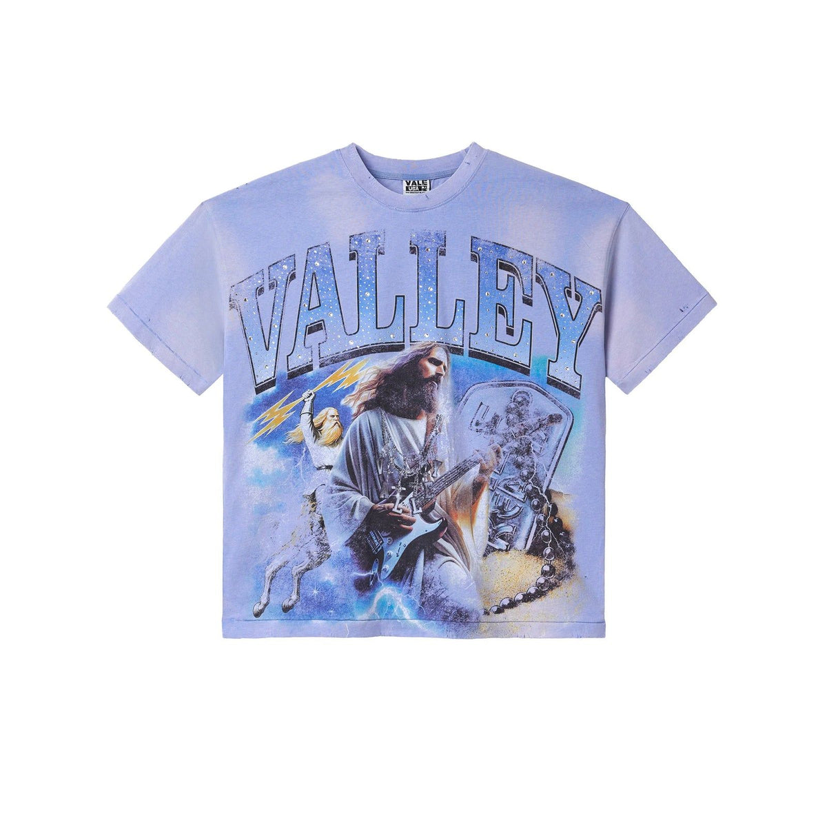 Periwinkle distressed tee with "VALLEY" in sparkly text. Graphic: Jesus playing electric guitar, winged figure, tombstone, stormy sky.