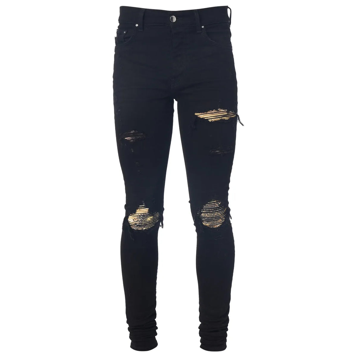 Black AMIRI MX1 skinny jeans with distressed rips at the knees and thighs, backed with a woven gold striped pattern.