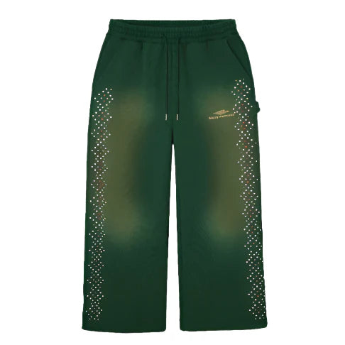 HMDD dark green wide-leg sweatpants with drawstring, vertical crystal lines down outer seams, and gold 'heavy movements' logo.