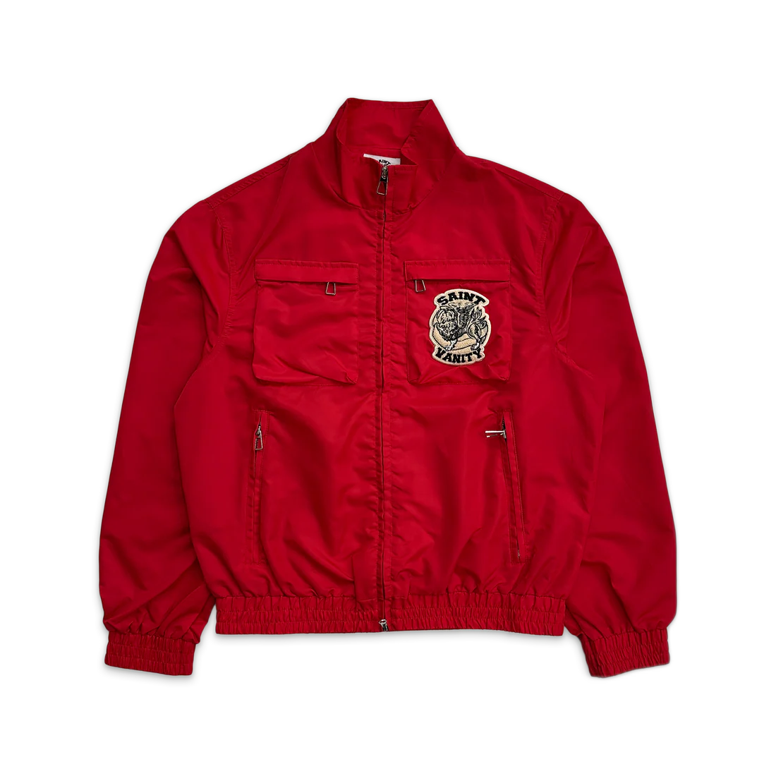 Saint Vanity red nylon cargo jacket with stand collar, full zip, 2 chest cargo pockets (one with Saint Vanity patch), and 2 zip pockets.