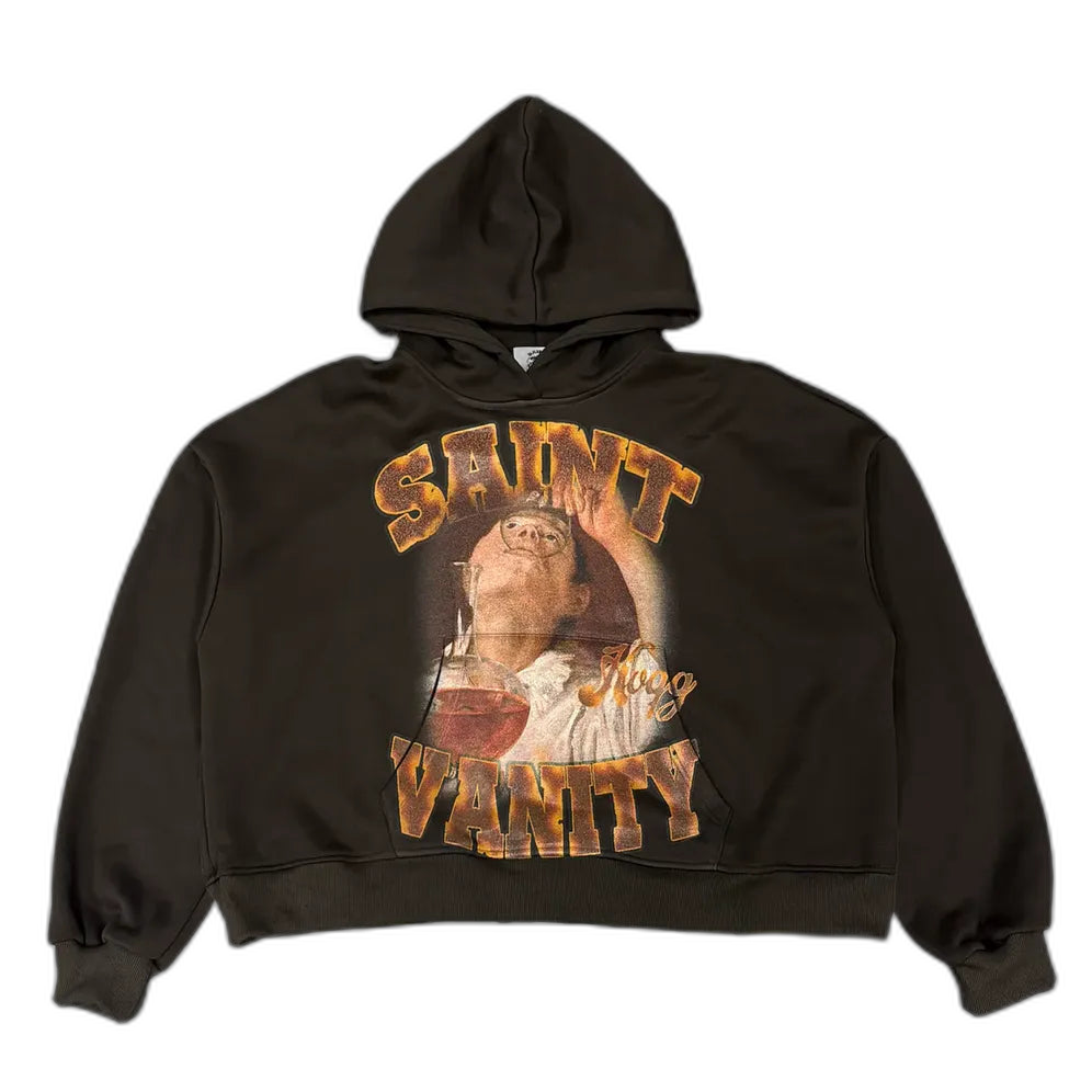 Dark brown Saint Vanity hoodie with vintage graphic: person looking up, pouring from an hourglass, 'SAINT' & 'VANITY' gold text.