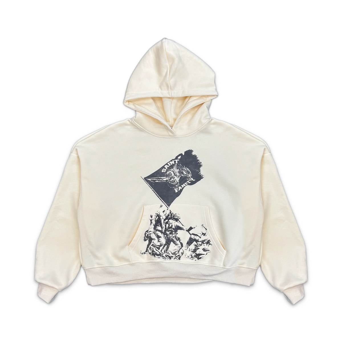 Cream Saint Vanity hoodie with a black flag graphic, "SAINT VANITY" text, and soldiers raising the flag over a pouch pocket.