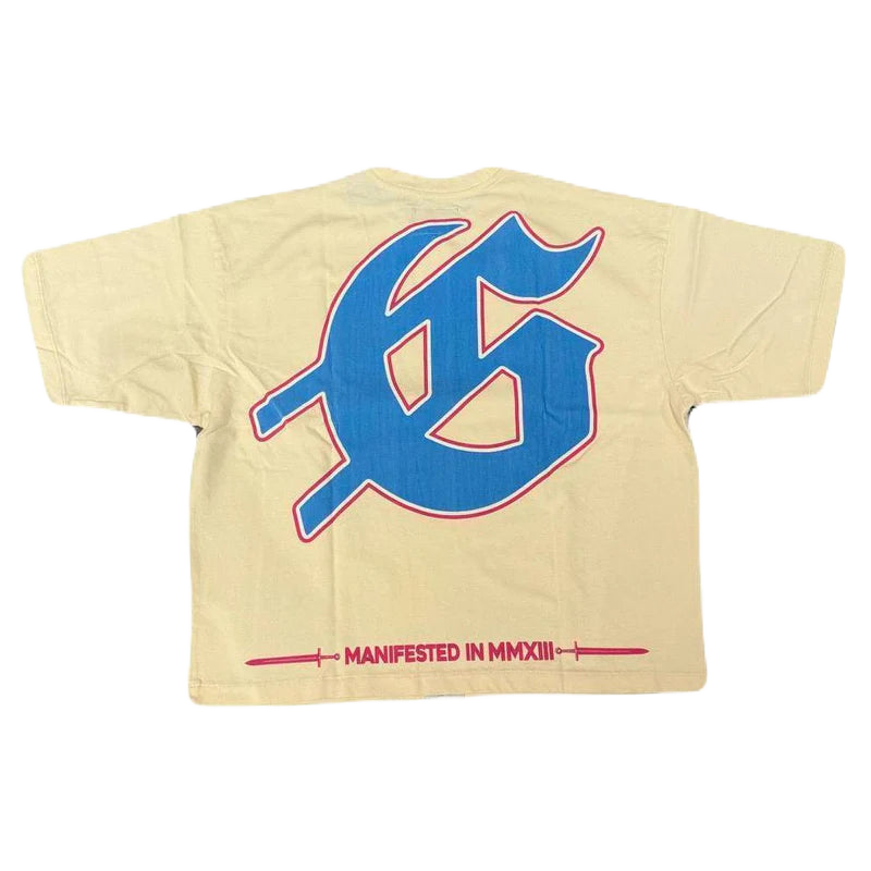 Cream Godspeed Miami Rari Tee, back view. Features a large blue Gothic "G" with red outline. Below, red text "MANIFESTED IN MMXIII" flanked by crosses.