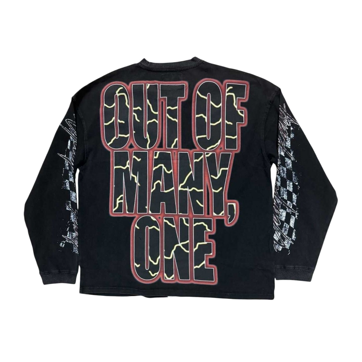 Black long-sleeve tee with 'OUT OF MANY, ONE' in red-bordered, cracked yellow text on back. Distressed white checkerboard sleeves.
