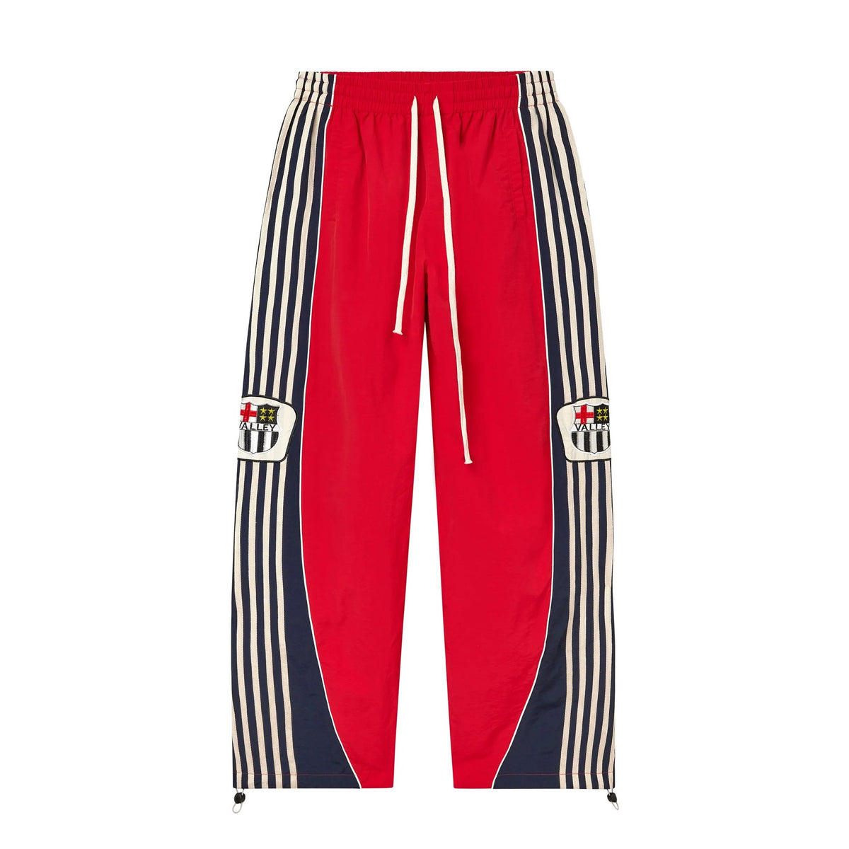 Red Vale Forever Lisbon Swish Pants with white drawstring, elastic waist, striped navy side panels, & "VALLEY" shield patches.