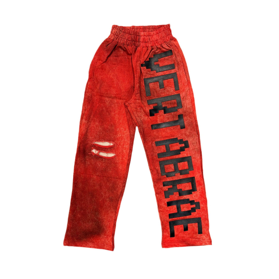 VERTABRAE C2 red distressed sweatpants with pixelated black VERTABRAE text on right leg, ripped left knee.