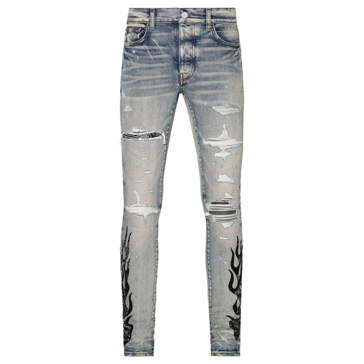 AMIRI Clay Indigo jeans, distressed with black & white bandana patches and black flame embroidery on lower legs.