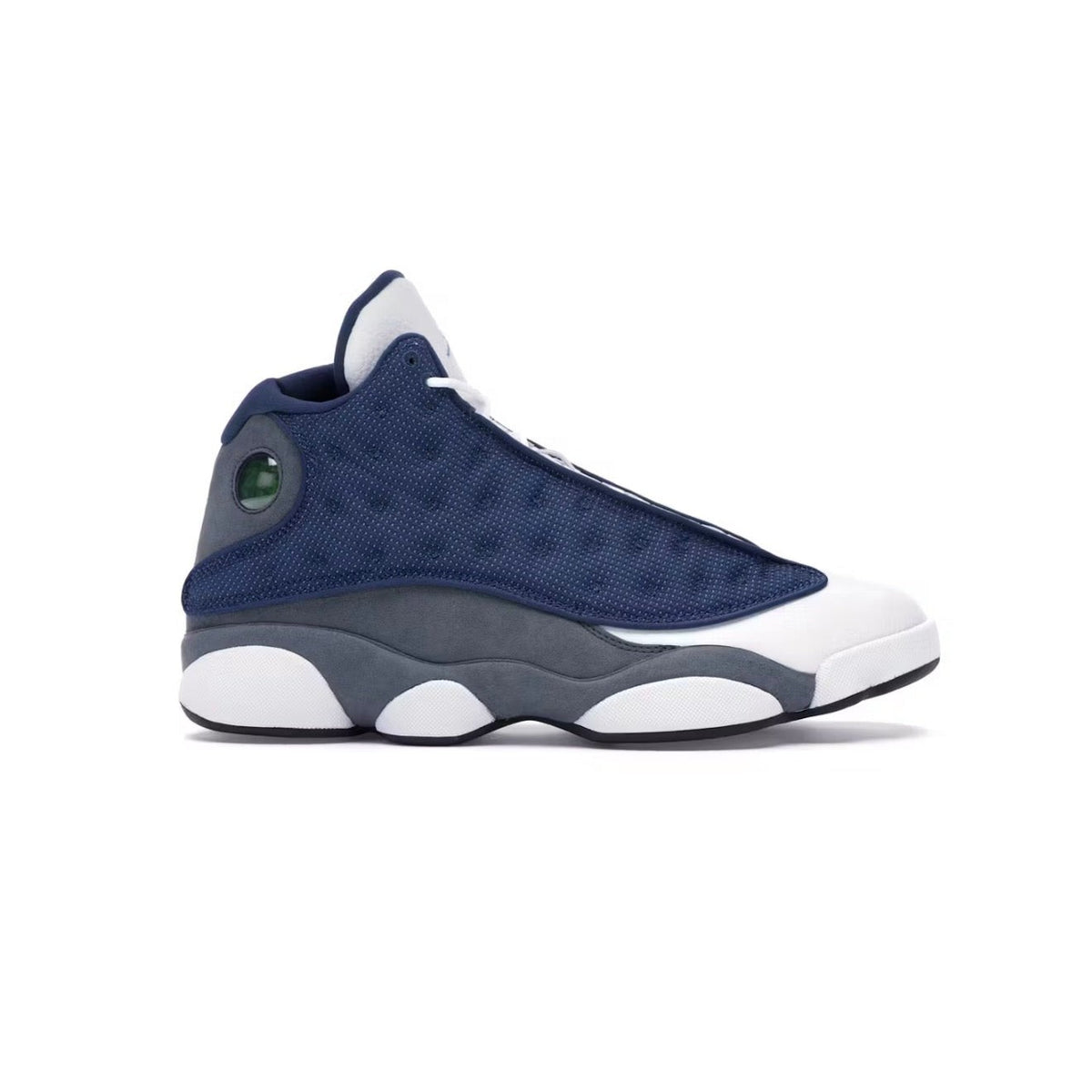 Air Jordan 13 Retro "Flint" mid-top sneaker in navy quilted mesh, grey suede, and white leather, with a green holographic emblem.