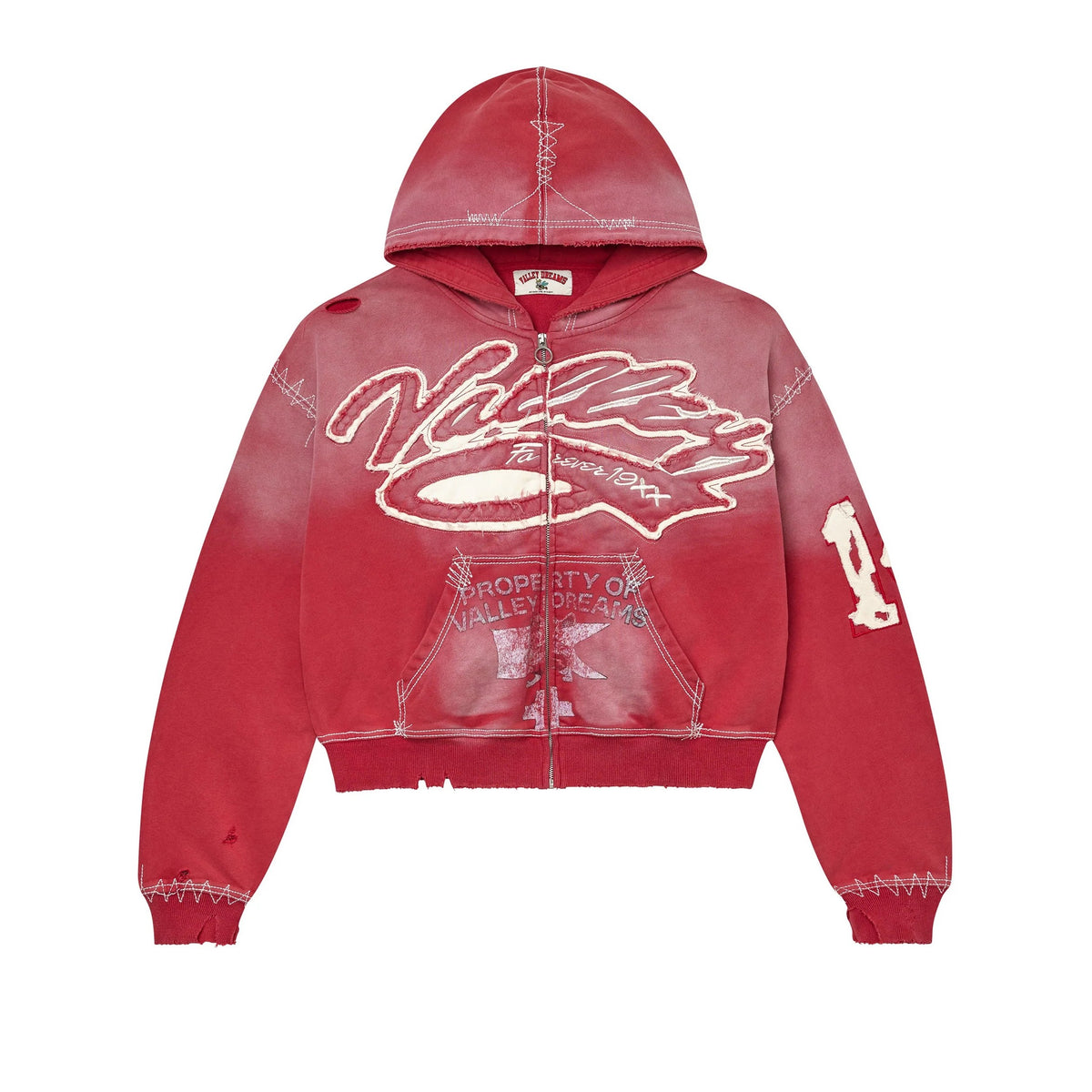Distressed red zip-up hoodie with white 'Vale Forever 19XX' appliqué, exposed stitching patterns, rips, and raw edges. VALLEY DREAMS tag.
