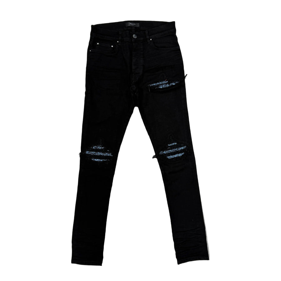 AMIRI Black OD Boucle MX 1 Jean, distressed with light blue boucle fabric visible through rips at knees/thighs. White side stripe.