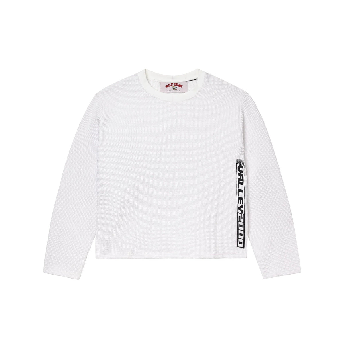 White waffle knit L/S thermal tee with ribbed crew neck. Features "VALLEY DREAMS" neck tag and vertical "VALLEY2000" stripe on right sleeve.