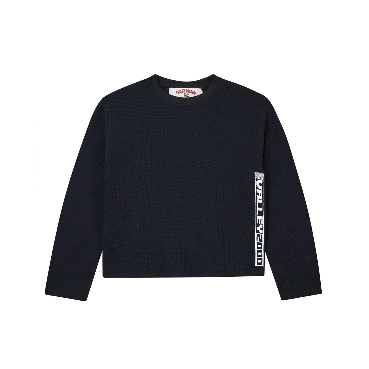 Black waffle-knit thermal long-sleeve tee with white "VALLEY 2000" text running vertically down the left side.