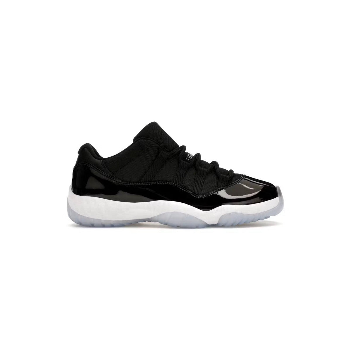 Air Jordan 11 Retro Low "Space Jam" sneaker. Black upper with shiny black patent leather, white midsole, and translucent outsole.