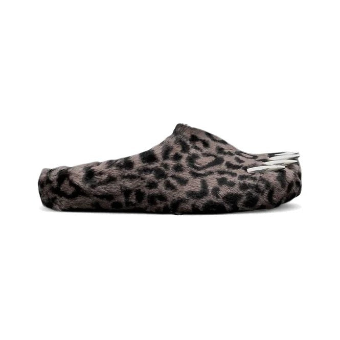Bravest Studio Bear Claw Mule: fuzzy dark leopard print shoe with three white claws protruding from the heel.
