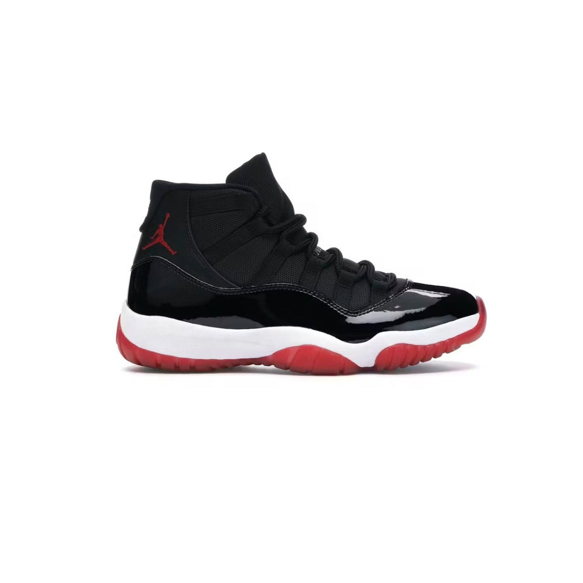 Air Jordan 11 Retro 'Bred' (2019) sneaker. Black mesh upper, glossy patent leather mudguard, red Jumpman logo, white midsole, and red translucent outsole.